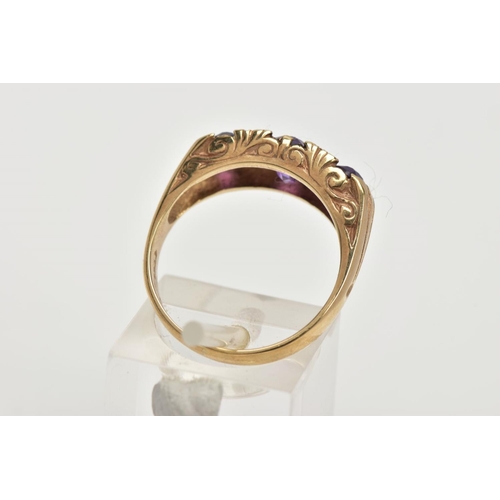 107 - A MODERN 9CT GOLD SEVEN STONE DRESS RING, designed with three oval cut amethyst's, interspaced with ... 