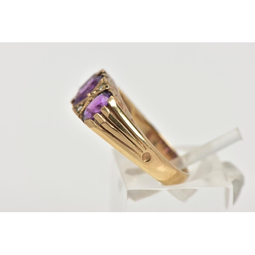 107 - A MODERN 9CT GOLD SEVEN STONE DRESS RING, designed with three oval cut amethyst's, interspaced with ... 