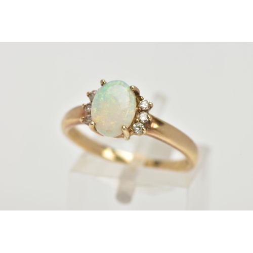 108 - A 9CT GOLD OPAL AND DIAMOND RING, centring on a four claw set oval white opal cabochon, showing flas... 