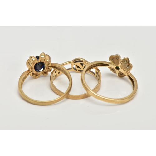 121 - THREE 9CT GOLD RINGS, the first set with an oval cut blue sapphire, within a floral surround set wit... 