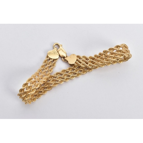 122 - A 9CT GOLD BRACELET, designed as a triple row of rope twist chains, fitted with a lobster claw clasp... 