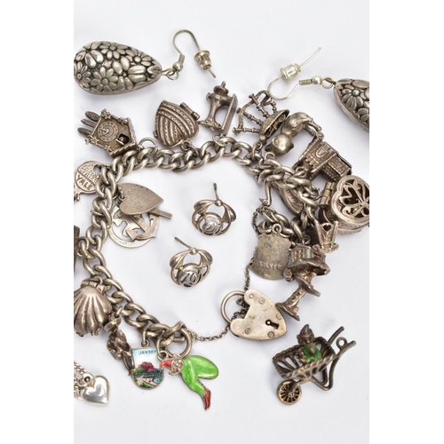 135 - A BAG OF ASSORTED SILVER AND WHITE METAL JEWELLERY, to include a charm bracelet fitted with various ... 