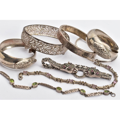138 - SIX BRACELETS AND A PAIR OF HOOP EARRINGS, to include a silver double jaguar head bracelet set with ... 