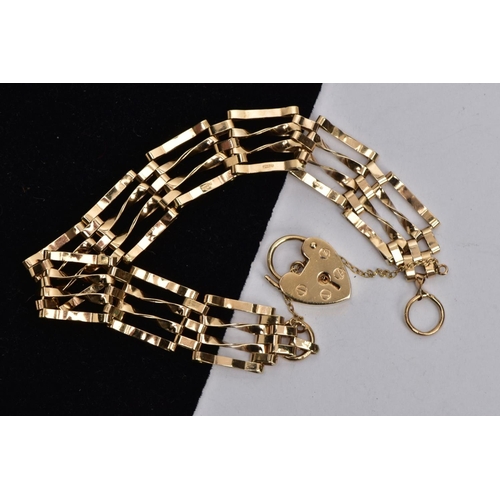 140 - A 9CT GOLD GATE BRACELET,  four bar polished yellow gold gate bracelet, fitted with a heart padlock ... 