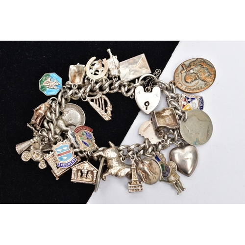 145 - A SILVER CHARM BRACELET, a curb link bracelet fitted with a heart padlock clasp and safety chain, ha... 