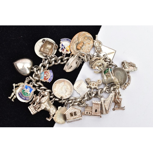 145 - A SILVER CHARM BRACELET, a curb link bracelet fitted with a heart padlock clasp and safety chain, ha... 