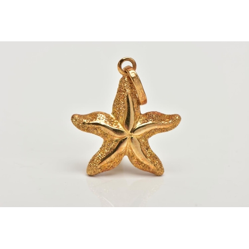 159 - A YELLOW METAL STARFISH PENDANT,  a textured yellow metal hollow pendant in the form of a starfish, ... 