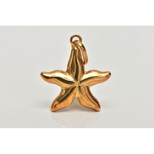 159 - A YELLOW METAL STARFISH PENDANT,  a textured yellow metal hollow pendant in the form of a starfish, ... 