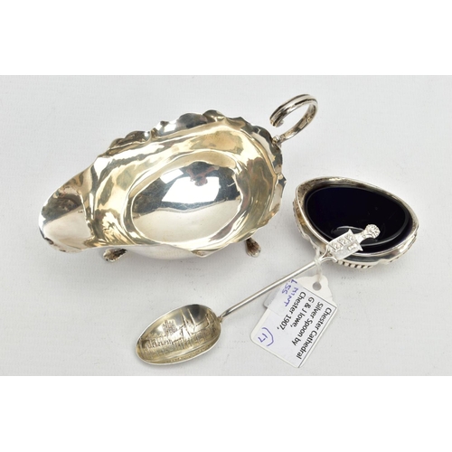 179 - A SILVER SAUCE BOAT, SALT AND TEASPOON, the sauce boat with a wavy rim, fitted with a scrolling hand... 
