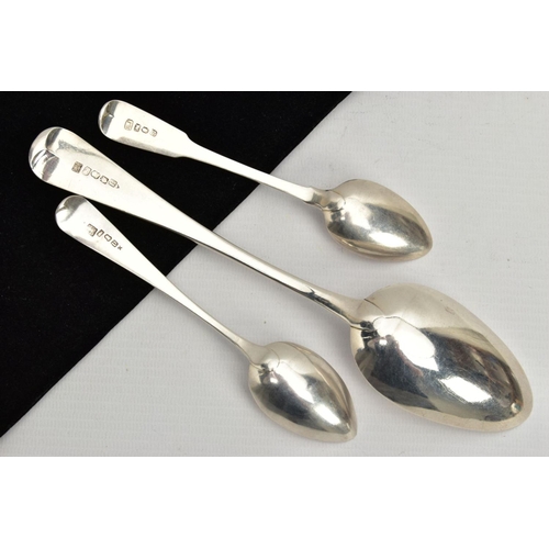 180 - THREE SILVER SPOONS, to include an old English pattern serving spoon, engraved initials to the termi... 