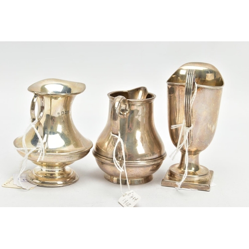 183 - THREE SILVER MILK JUGS, each in a different form fitted with scrolling handles, each with a full sil... 