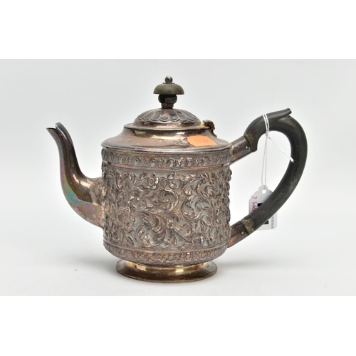 184 - A LATE VICTORIAN SILVER TEAPOT, embossed floral and foliate design, fitted with an ebonised wooden h... 