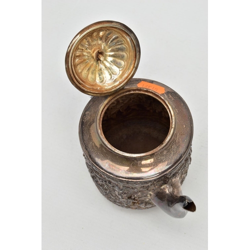 184 - A LATE VICTORIAN SILVER TEAPOT, embossed floral and foliate design, fitted with an ebonised wooden h... 