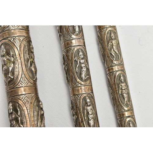 185 - AN ASIAN WHITE METAL WALKING CANE, embossed religious figures throughout, can be taken apart into th... 