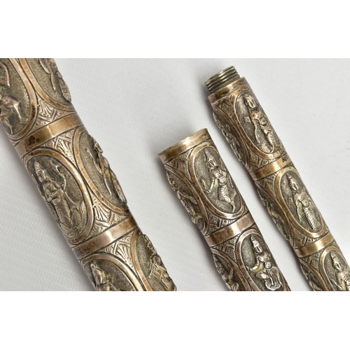 185 - AN ASIAN WHITE METAL WALKING CANE, embossed religious figures throughout, can be taken apart into th... 