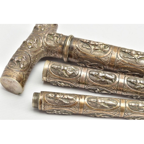 185 - AN ASIAN WHITE METAL WALKING CANE, embossed religious figures throughout, can be taken apart into th... 