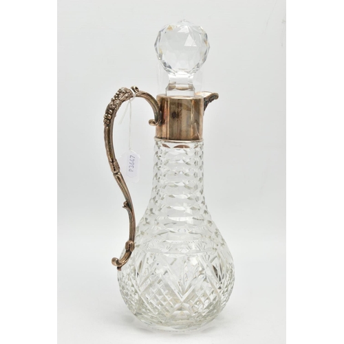 190 - A SILVER MOUNTED GLASS CLARET JUG, Bacchus face to the collar, fitted with a scrolling handle decora... 