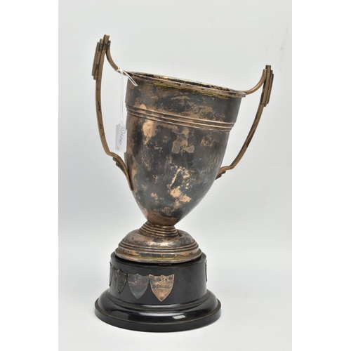 192 - AN AF SILVER TROPHY CUP, misshapen tropy cup of a tapered form, fiited with two handles, on a round ... 