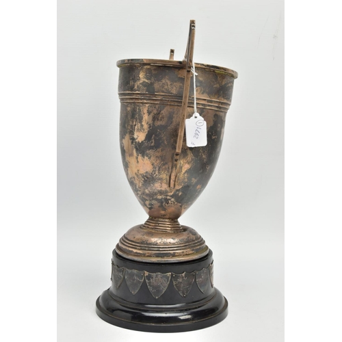 192 - AN AF SILVER TROPHY CUP, misshapen tropy cup of a tapered form, fiited with two handles, on a round ... 