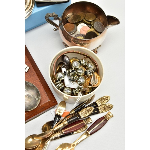 224 - A BOX OF ASSORTED ITEMS, to include a pair of novelty white metal talon feet candlesticks, a silver-... 