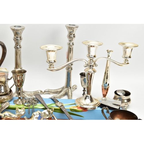 224 - A BOX OF ASSORTED ITEMS, to include a pair of novelty white metal talon feet candlesticks, a silver-... 