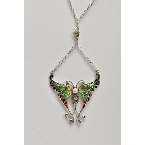 39 - A PLIQUE A' JOUR BUTTERFLY NECKLACE, a white metal butterfly set with four circular cut rubies, a wh... 