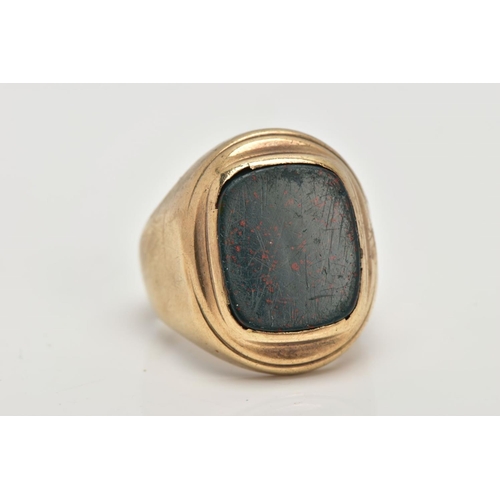 4 - A 9CT BLOODSTONE SIGNET RING, a rectangular bloodstone inlayed into an oval yellow gold collet mount... 