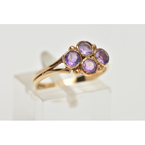 45 - A 9CT GOLD AMETHYST RING, designed with four circular cut amethysts each bezel set into a lozenge sh... 