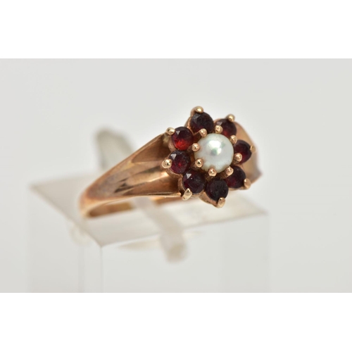 48 - A 9CT GOLD GARNET AND PEARL CLUSTER RING, centring on a single cultured pearl, measuring approximate... 