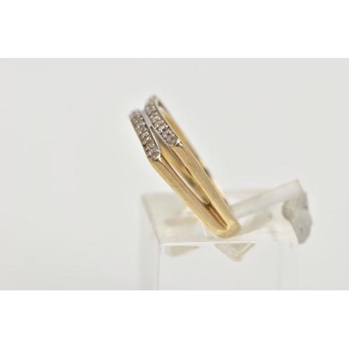 54 - A 9CT GOLD DIAMOND RING, designed with two slightly curved rows of channel set single cut diamonds, ... 