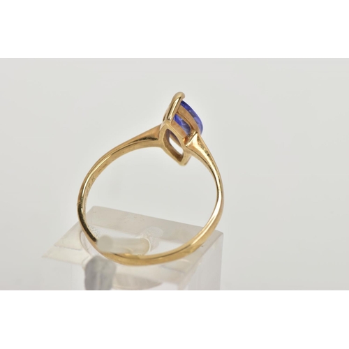 60 - A 9CT GOLD TANZANITE RING, designed with a marquise cut tanzanite, approximate dimensions length 11.... 