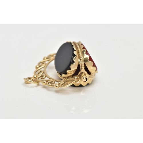 64 - A 9CT GOLD SWIVEL FOB, set with oval cut onyx, carnelian and bloodstone panels, openwork scroll moun... 