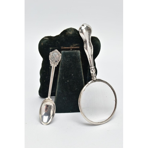 83 - A SILVER PHOTO FRAME, TEASPOON AND A MAGNIFYING GLASS, the photo frame of a wavy rectangular form, e... 