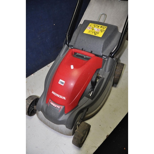 1300 - A HONDA HRE 370 LAWNMOWER electric lawn mower with grass box and a Qualcast Panther 30 push along la... 