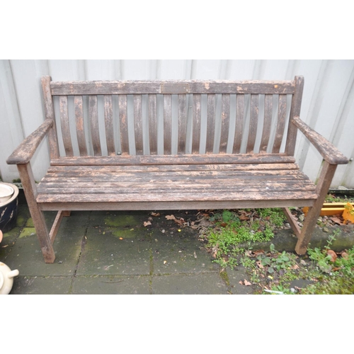 1215 - A HARDWOOD GARDEN BENCH with slatted seat and back with a brass plaque from the Moor Hall Luncheon C... 