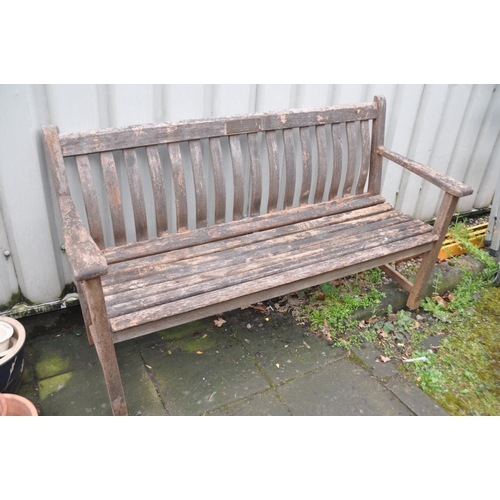 1215 - A HARDWOOD GARDEN BENCH with slatted seat and back with a brass plaque from the Moor Hall Luncheon C... 