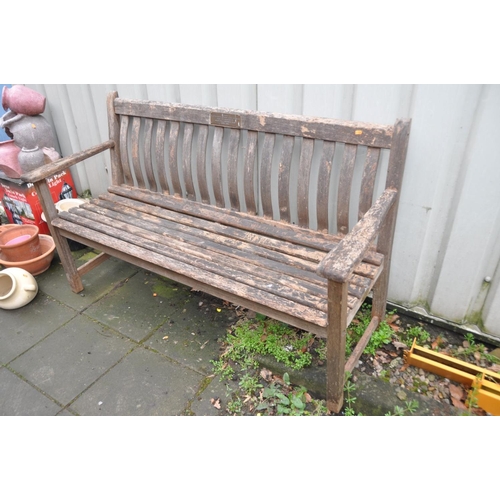 1215 - A HARDWOOD GARDEN BENCH with slatted seat and back with a brass plaque from the Moor Hall Luncheon C... 