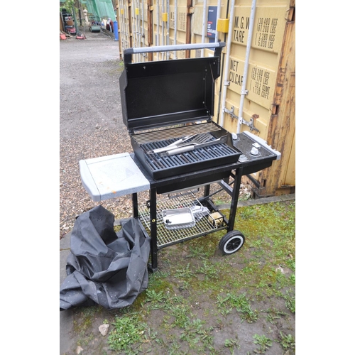 1217 - A WEBER SILVER GAS BARBECUE with two burners, side extension, undershelf, tools and cover enclosure,... 