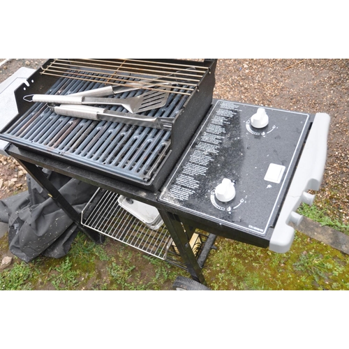 1217 - A WEBER SILVER GAS BARBECUE with two burners, side extension, undershelf, tools and cover enclosure,... 