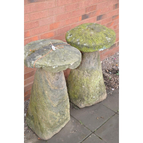 1226 - TWO COMPOSITE STADDLE STONE BASES one with a round sandstone top (with some age) the other with a re... 