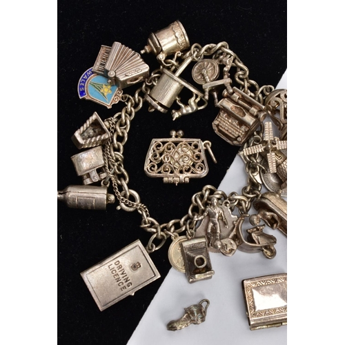 102 - TWO SILVER CHARM BRACELETS AND LOOSE CHARMS, the first a curb link chain each link stamped sterling,... 