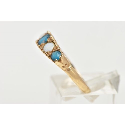 107 - A 9CT GOLD FIVE STONE RING, set with a row of three circular cut blue stones, interspaced with two c... 