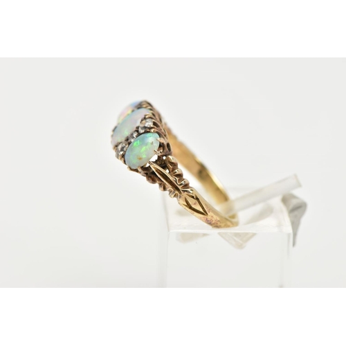 110 - AN EARLY 20TH CENTURY OPAL AND DIAMOND DRESS RING, designed with three oval opal cabochons, showing ... 