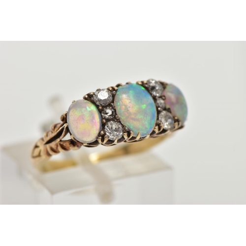 110 - AN EARLY 20TH CENTURY OPAL AND DIAMOND DRESS RING, designed with three oval opal cabochons, showing ... 