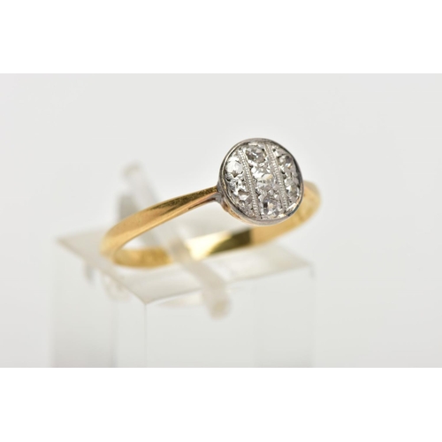 119 - A YELLOW METAL DIAMOND RING, the ring head of a circular design set with three old cut diamonds and ... 