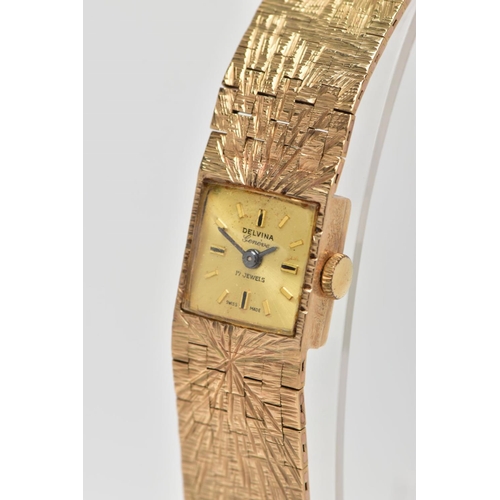 123 - A LADIES 9CT GOLD 'DELVINA' WRISTWATCH, hand wound movement, square gold dial signed 'Delvina, Genev... 