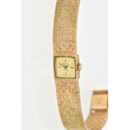 123 - A LADIES 9CT GOLD 'DELVINA' WRISTWATCH, hand wound movement, square gold dial signed 'Delvina, Genev... 