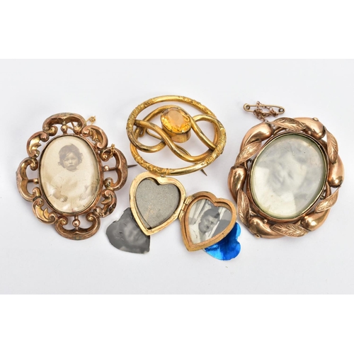 129 - THREE BROOCHES AND A LOCKET PENDANT, to include an oval yellow metal double photograph swivel brooch... 