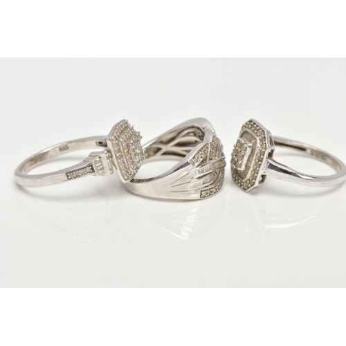 142 - THREE WHITE METAL DIAMOND SET DRESS RINGS, large dress rings each set with a variety of single cut a... 