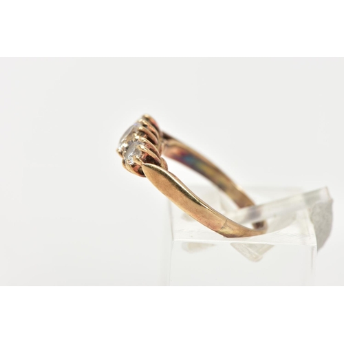 144 - A 9CT GOLD THREE STONE RING, set with three circular cut cubic zirconia, each in a claw setting, lea... 